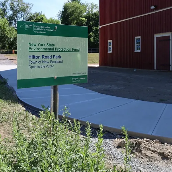 A sign reads "New York State Environmental Protection Fund Hilton Road Park Open to the Public".